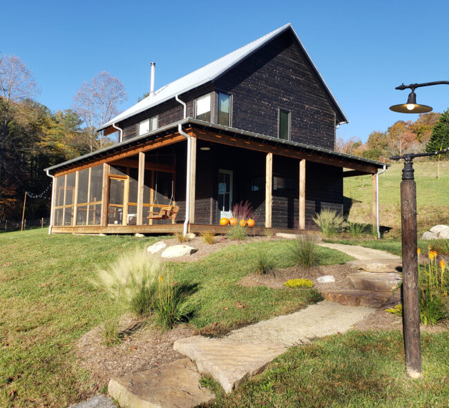 Scandinavian style barn renovation with modern landscaping